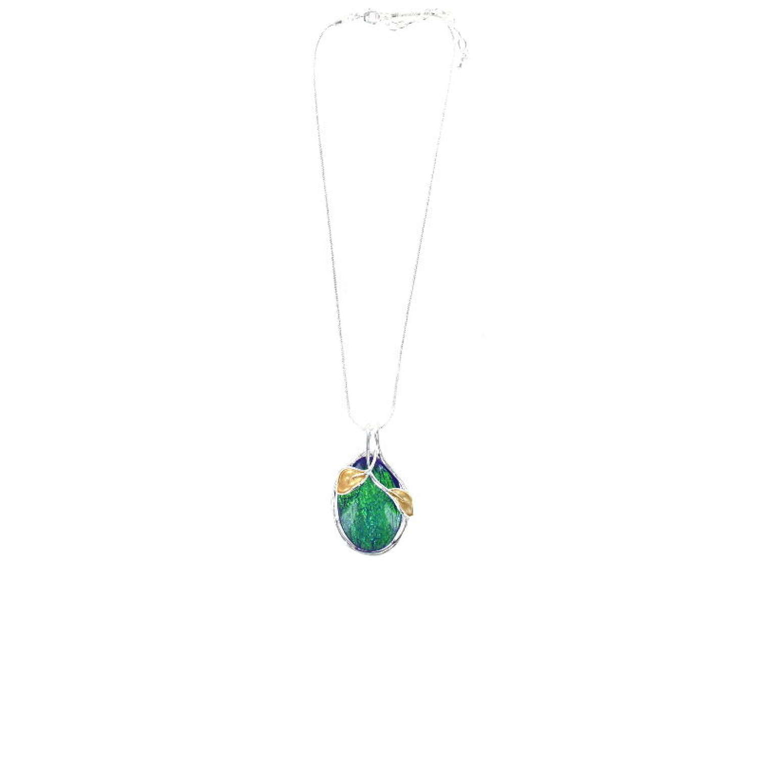 Green pendant necklace on silver tone snake chain.